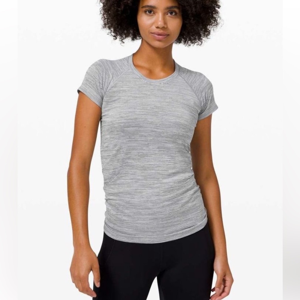 Lululemon Swiftly 2.0 We are from Space, white and black. Hip length.